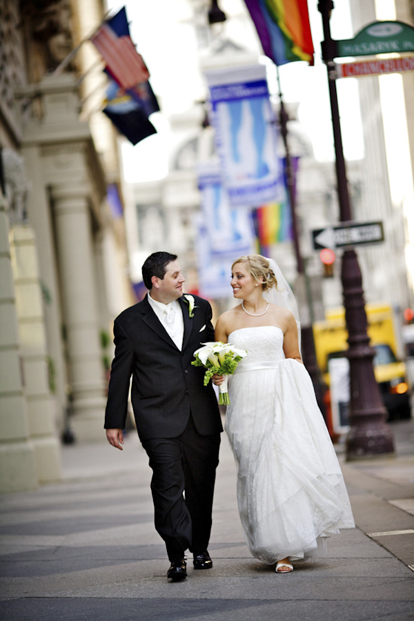 The happy couple walking the city streets - wedding photo by top Atlanta-based wedding photographer Scott Hopkins Photography